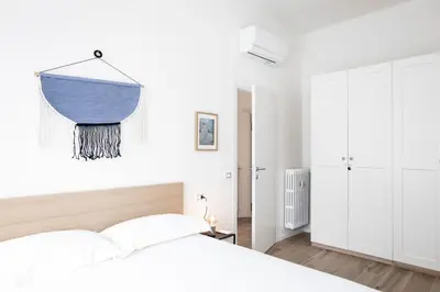 Letto o letti in una camera di Leopoldo Cozy Loft - Tramvia vicino casa