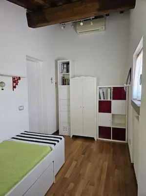 Letto o letti in una camera di Casina Rossa