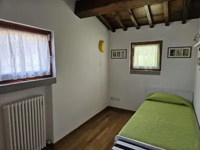 Letto o letti in una camera di Casina Rossa