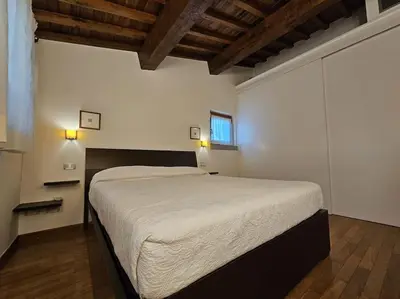 Letto o letti in una camera di Casina Rossa