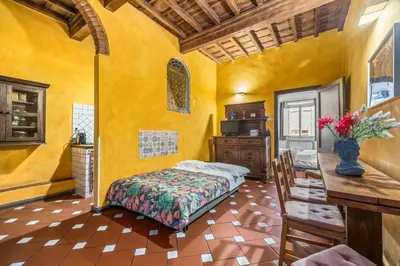 Letto o letti in una camera di Oltrarno Artisan Residence C&G