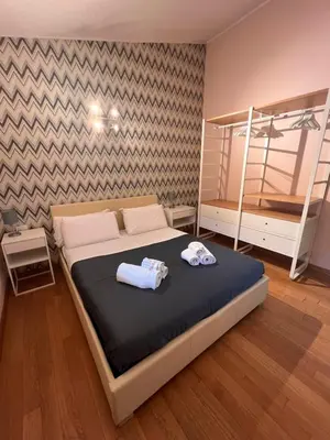 Letto o letti in una camera di Orcagna 10 Elegante appartamento