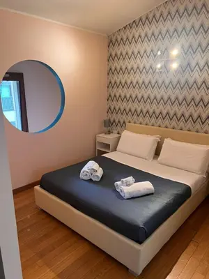 Letto o letti in una camera di Orcagna 10 Elegante appartamento