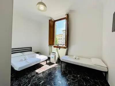 Letto o letti in una camera di BNB Centrale