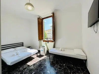 Letto o letti in una camera di BNB Centrale