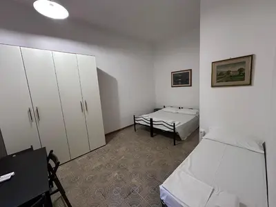 Letto o letti in una camera di BNB Centrale