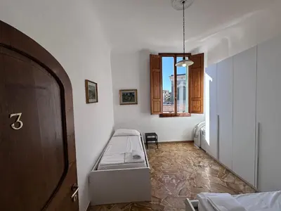Letto o letti in una camera di BNB Centrale