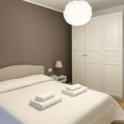 Letto o letti in una camera di Appartamento Firenze Careggi con parcheggio