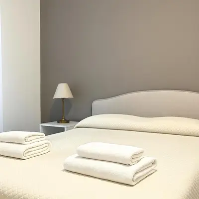 Letto o letti in una camera di Appartamento Firenze Careggi con parcheggio