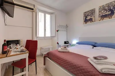Letto o letti in una camera di Magico Risveglio Piazza Signoria