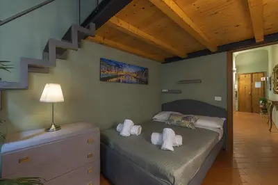 Letto o letti in una camera di Sant Ambrogio Green Pepper Apartment