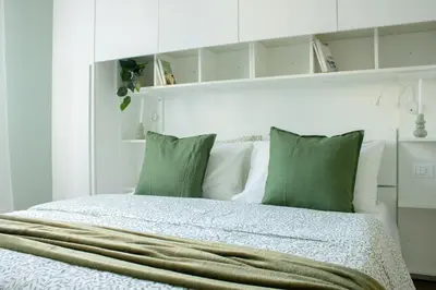 Letto o letti in una camera di Mias flat by DomusDimore