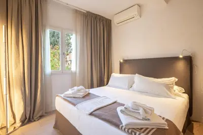 Letto o letti in una camera di Maison Costa dei Magnoli