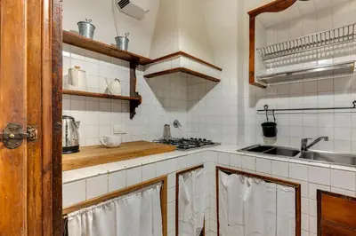 Cucina o angolo cottura di Guelfo Apartment by Mamo Florence