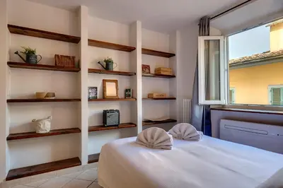 Letto o letti in una camera di Guelfo Apartment by Mamo Florence