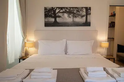 Letto o letti in una camera di APT DELUXE in THE HEART OF CITY