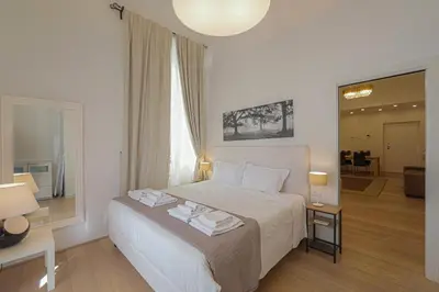 Letto o letti in una camera di APT DELUXE in THE HEART OF CITY