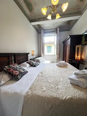 Letto o letti in una camera di Casa Maya Souvenir