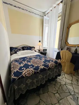 Letto o letti in una camera di Casa Maya Souvenir