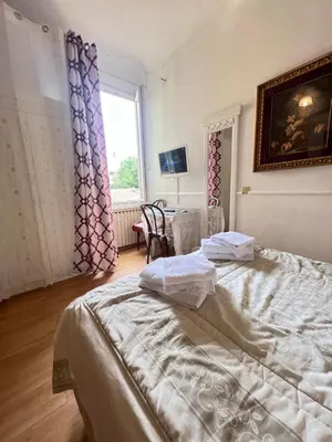 Letto o letti in una camera di Casa Maya Souvenir
