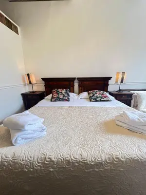 Letto o letti in una camera di Casa Maya Souvenir