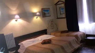 Letto o letti in una camera di Casa Maya Souvenir