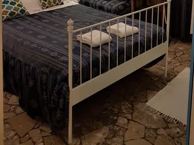 Letto o letti in una camera di Casa Maya Souvenir