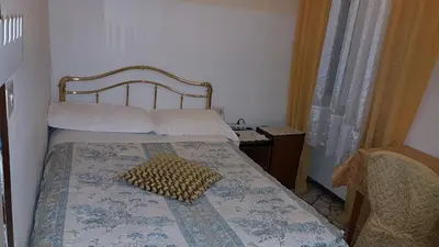 Letto o letti in una camera di Casa Maya Souvenir