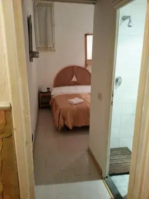 Letto o letti in una camera di Casa Maya Souvenir