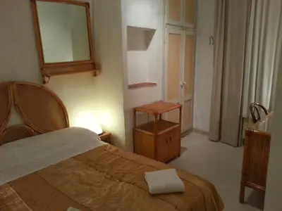 Letto o letti in una camera di Casa Maya Souvenir