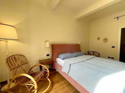 Letto o letti in una camera di Orto di Beatrice-Casa con Giardino