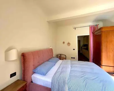 Letto o letti in una camera di Orto di Beatrice-Casa con Giardino