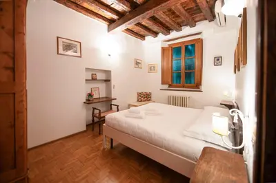Letto o letti in una camera di Terme Apartment by Mamo Florence