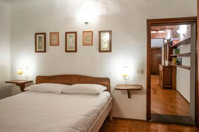 Letto o letti in una camera di Terme Apartment by Mamo Florence