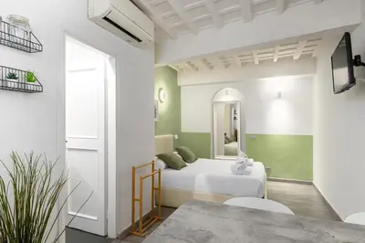 Letto o letti in una camera di UNYCA - Cozy Studio in Florence