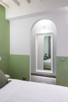 Letto o letti in una camera di UNYCA - Cozy Studio in Florence