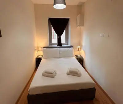 Letto o letti in una camera di Sprone Apartments in Florence