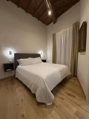 Letto o letti in una camera di Sprone Apartments in Florence