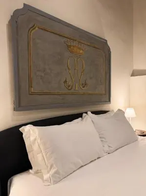 Letto o letti in una camera di Sprone Apartments in Florence