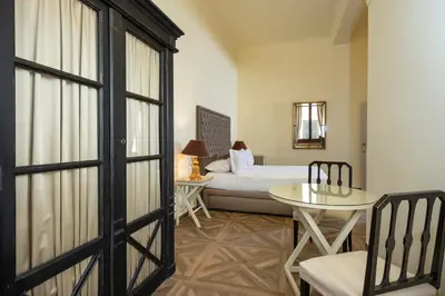 Letto o letti in una camera di Palazzo Martellini Residenza d'epoca
