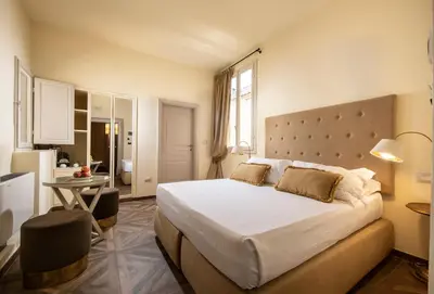 Letto o letti in una camera di Palazzo Martellini Residenza d'epoca