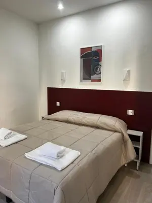 Letto o letti in una camera di Bella Ciao Firenze