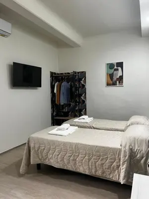 Letto o letti in una camera di Bella Ciao Firenze