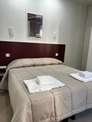 Letto o letti in una camera di Bella Ciao Firenze