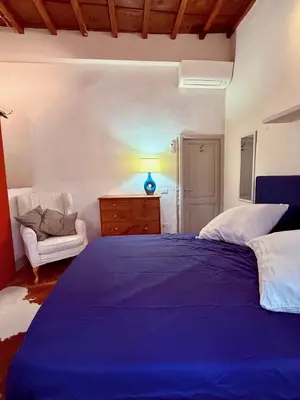 Letto o letti in una camera di Santo Spirito House & Suite