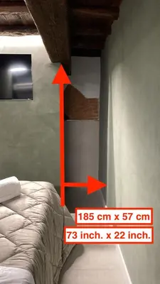 Letto o letti in una camera di Keys of Italy - Vigna Vecchia 24 - Cozy Mezzanine in Santa Croce