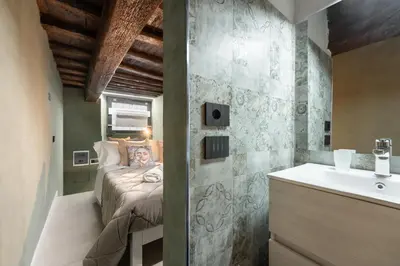 Letto o letti in una camera di Keys of Italy - Vigna Vecchia 24 - Cozy Mezzanine in Santa Croce