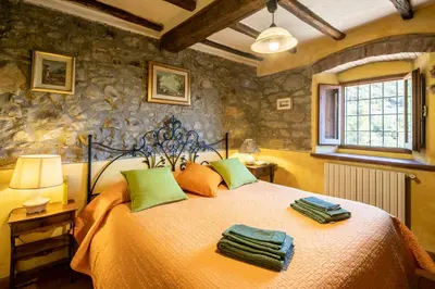 Letto o letti in una camera di Casale Giaggiolo