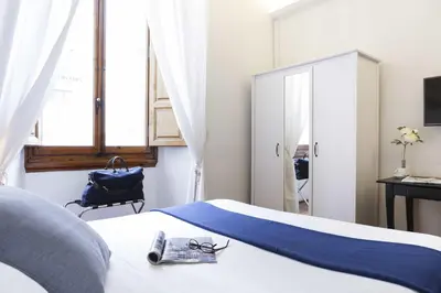 Letto o letti in una camera di B&B Prestigia Rooms