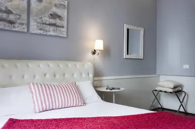 Letto o letti in una camera di B&B Prestigia Rooms